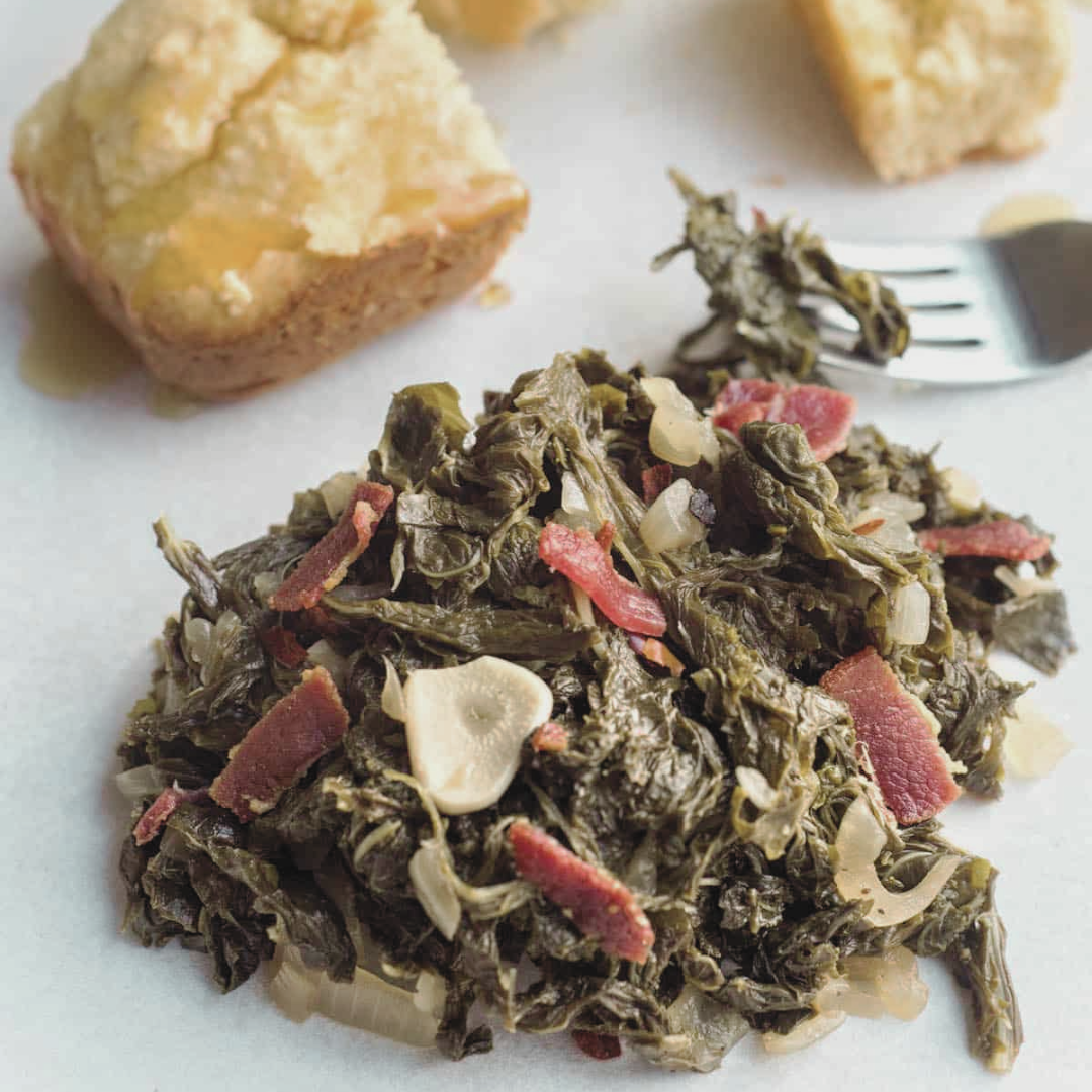 A plate of mustard greens with some cornbread just calling my name.